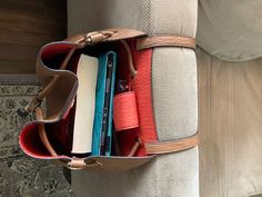 an open purse with several books in it