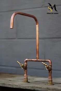 an old faucet made out of copper pipes