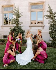 a bride and her bridal party in front of a building