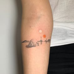 a person with a small tattoo on their arm