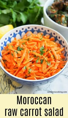 a bowl filled with carrots next to other vegetables