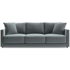 a gray couch with two pillows on it