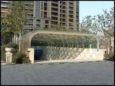 an empty bus stop in the middle of a city