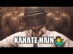 a man sitting in a chair wearing a tie and a helmet with the words kahate hain on it