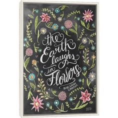 the earth laughs in flowers written on a chalkboard