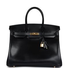 This Birkin in Black boxcalf leather with gold hardware has tonal stitching, front flap with two straps, front toggle closure, clochette with lock and two keys, and double rolled handles The interior is lined with Black chevre and features one zip pocket with an Hermes engraved pull.Collection: AOrigin: FranceCondition: Never worn (plastic on hardware)Accompanied by: Hermes box, dustbag, ribbon, rainhat, carebook, clochette, clochette dustbag, lock, two keysMeasurements: 11" width x 13.75" height x 7" depth; 4" handle drop Hermes Birkin 35 Black, Birkin 35 Black, Dream Bag, Hermes Birkin 30, Fashion Aesthetics, Madison Avenue