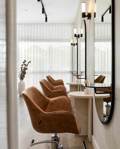 a chair that is sitting in front of a mirror