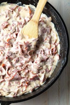 a skillet filled with meat and gravy