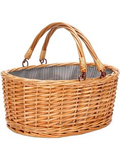 a wicker basket that is holding a striped fabric lining on the inside of it