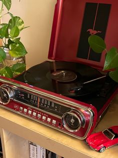 Vintage Ford Mustang 
Record player
Thrift store 
Vintage 
Dark red Filmy Vintage, Future Apartment Decor, Deco Originale, Room Deco, Apartment Decor Inspiration, Dream Room Inspiration, Room Makeover Inspiration, Future Apartment, Dream Apartment