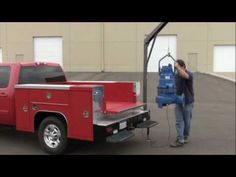 a man standing next to a red fire truck