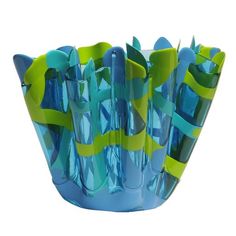 a glass vase with blue and green designs on it