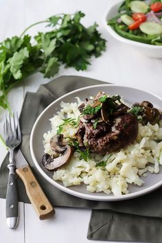 a white plate topped with rice and mushrooms