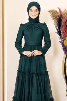 It is produced using lycra tulle fabric. The chest part is shirred, the skirt is frilly. It is lined. The length of the product is 160 cm, the Mannequin is 1.75 in size 36. Eid Floor-length Ruffled Dresses, Floor-length Ruffled Dress For Eid, Eid Long Sleeve Ruffled Dresses, Modest Long Dress For Party, Modest Long Party Dress, Modest Long Green Dress, Long Ruffled Wedding Dress, Modest Formal Dress For Eid, Modest Long Maxi Dress For Wedding