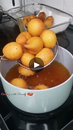 a bowl filled with food sitting on top of a stove