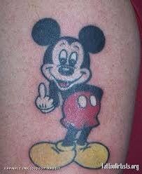 a mickey mouse tattoo on the arm