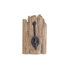 an iron door handle on a wooden fence