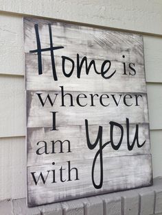 a sign that says home is wherever i am with you