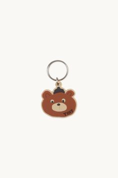 A brown bear keychain equipped with a sturdy ring, ideal for securely organizing your keys or adorning little backpacks.Our suppliers count with both BSCI and SEDEX certificates. SEDEX certification demonstrates the company’s commitment to ethical sourcing, sustainable practices, and social responsibility. The BSCI certification showcases the company’s dedication to ensuring fair working conditions and upholding labor standards throughout its supply chain.Measures: 4,3 cm X 4 cm. Unlock Screen, Bear Keychain, Tiny Cottons, Sustainable Practices, Social Responsibility, Supply Chain, Brown Bear, Key Chain, Key