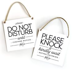 two signs hanging from twine with rope attached to each other, one saying please do not disturb and the other saying don't