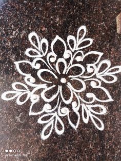 an intricately designed design on the ground