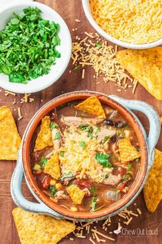 mexican soup with tortilla chips and greens