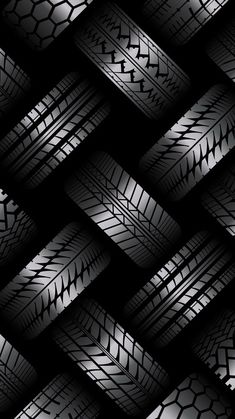 an abstract black and white background with tire treads