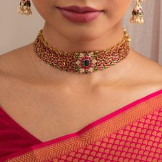 Description One of our favorites at Paksha! Contemporary aesthetics meet traditional elegance in this gold plated silver choker. Intricate floral motifs, studded with closely set semi-precious Kempu stones this versatile necklace sits perfectly pretty on the neck. Product Information Materials used : 925 Silver with 1.0-microns Gold Plating Stones: Semi precious stones Length: 20 cm and adjustable Findings: Hook and links Luxury Traditional Choker For Festive Occasions, Affordable Traditional Jewelry For Festive Occasions, Gold Plated Jewelry Indian, Simple Choker Necklace, Choker Sets, Mango Mala, Gold Jewelry Prom, Jaipur Jewelry, Beautiful Bangles