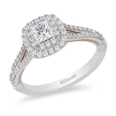 a diamond engagement ring with two tone gold and white diamonds