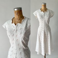 A sweet summer dress from the 1940s! This adorable dress is made from white cotton eyelet lace. It has a flattering scalloped neckline, wide cap sleeves, a nipped waist, and a full, midi length skirt. The dress features flattering seaming at the waist, a back button closure with clear buttons, and a flounced / bustled back. Side zipper closure. Unlined.  *due to the cutouts, the dress may require a slip depending on your comfort level  Brand: none, handmade  Material: cotton  Estimated Size: Small   Measurements: Shoulder: 15" Bust: 34" - snug 35" Waist: 28"  Hip: 41" Length: 43.5"  Condition: Great vintage condition! I have made some scattered mends to a few of the the eyelet cutouts, the biggest being on one side of the waist, as well as the corners of the neckline. Some oxidation to the 1950s White Vintage Summer Dress, 1950s Style White Vintage Summer Dress, White 1950s Vintage Summer Dress, Vintage 40s Dress, Farm Dress, 40s Dress, Bustle Dress, Scalloped Neckline, Lace Cutout