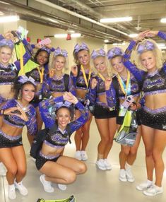 a group of cheerleaders posing for a photo