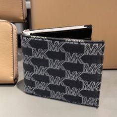 Michael Kors Men’s Women’s Cooper Logo Fabric Billfold Wallet Black Multi 36s3lc0f10 Unisex New With The Tag Authentic An Everyday Canvas Billfold That Only Improves With Wear, The Cooper Is Outfitted With Bill Compartments, Card Slots And A Coin Pouch To Keep All Your Payment Options Organized. It’s A Classic You Can Count On For Years To Come. Billfold Wallet 4”W X 4”H X 1”D Interior Details: Billfold Compartment, Coin Pouch, 4 Card Slots Billfold Wallet Fabric And Smooth Leather Mk Logo Print Classic Michael Kors Wallets For Daily Use, Michael Kors Classic Wallet For Daily Use, Designer Black Wallet For Everyday, Designer Black Everyday Wallet, Black Rectangular Wallet With Logo, Black Rectangular Wallets With Logo, Black Business Bifold Bag, Black Business Wallet With Logo, Modern Michael Kors Rectangular Wallets