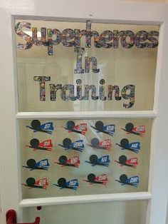 there is a display in the window that says superheros in training