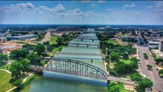 an aerial view of a bridge over a river