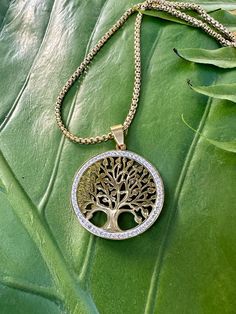 This necklace celebrates the Tree of Life, a universal spiritual symbol representing growth, wisdom, protection, beauty, strength and redemption.  The stainless steel pendant measures 1.25 inches in diameter and hangs on very high-quality tarnish-resistant stainless steel gold chain.*Please choose your desired chain length from the listing's menu.  This piece is stunningly accented with Cubic Zirconia gemstones.  Made with a lobster clasp to ensure secure and easy styling. * Arrives GIFT-READY i Spiritual Tree Of Life Jewelry Gift, Spiritual Tree Of Life Jewelry For Gifts, Spiritual Tree Of Life Jewelry As A Gift, Yoga Necklace, Dried Rose Petals, Symbol Necklace, Crystal Tree, Tree Of Life Pendant, Tree Pendant