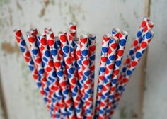 red, white and blue paper straws in a vase