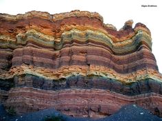 an image of colorful rock formations in the mountains with captioning below that reads