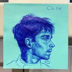 a drawing of a man's face on a piece of paper with the name clio written in blue ink