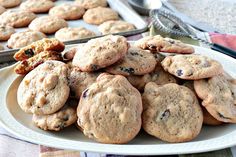 chocolate chip cookies on a plate next to baking pans