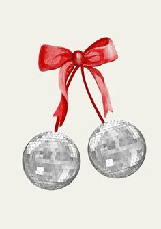 two silver disco balls tied with a red ribbon and bow on a light gray background