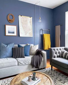 a living room with blue walls and furniture