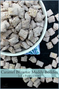 caramel brownie muddy buddies in a white bowl on a black table with the words caramel brownie muddy buddies