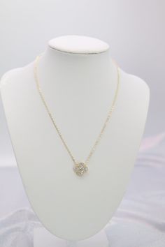 A CZ (Cubic Zirconia) clover gold necklace features a delicate gold chain that gracefully supports a shimmering, clover-shaped pendant adorned with cubic zirconia stones. The sparkling stones add a touch of elegance and brilliance, making this necklace a sophisticated accessory perfect for adding a bit of glamour to any outfit. Length: 16” Clover Measures: 15.0 mm Closure: Lobster Claw Material: Brass with 18K Gold Plating with Rhodium Coating Lead Free and Hypoallergenic Gold Cubic Zirconia Diamond Necklace With Flower Pendant, Gold Diamond Necklace With Cubic Zirconia Flower Pendant, Delicate Gold Chain, Holiday Jewelry, Gold Plated Necklace, Cz Stone, Tassel Earrings, Ring Bracelet, Christmas List