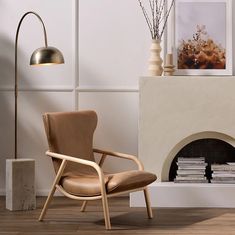 a chair sitting next to a fireplace in a living room