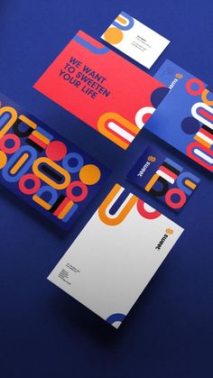 three different business cards on top of each other with the letter u in bold colors