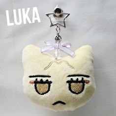 a stuffed animal keychain with an embellishment on it