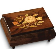 a wooden box with flowers painted on it