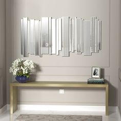 This wall mirror adds a touch of elegance to any wall it's placed on.The mirror is finished entirely in glass, with irregular metal trim around the outer edge of the primary mirror, adding visual interest to the mirror and drawing the eye from anywhere in the room.At 47.2" height and 24.8" wide, this wall mirror can be placed in almost any type of room to add a touch of elegance and interest to an area. Add to your home with this rectangular beveled glass wall mirror.Each raised bump around the Mirror Dining Room, Gold Bed, Decorative Wall Mirror, Mirror Wall Bedroom, Contemporary Wall Mirrors, Oval Wall Mirror, Types Of Rooms, Metal Trim, Wall Mirrors