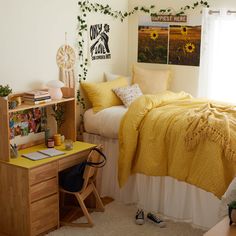 a bed room with a neatly made bed and desk