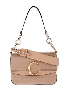 Chloé Shoulder BagNeutrals Embossed LeatherMultitonal HardwareFlat Handle & Single Adjustable Shoulder StrapSingle Exterior PocketCanvas Lining & Single Interior PocketPush-Lock Closure at FrontIncludes Dust Bag Embossed Leather, Emboss, Cross Body Handbags, Leather Shoulder Bag, Chloe, Dust Bag, Women Handbags, Exterior, Shoulder Bag